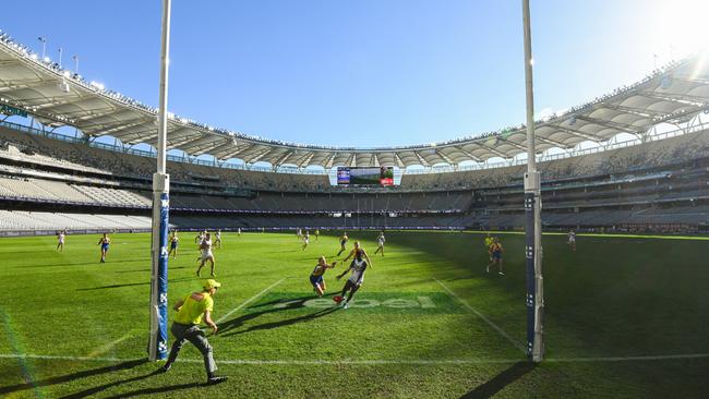 Michael Frederick’s goal for the Fremantle Dockers was overshadowed by an empty Optus Stadium at the AFL derby in Perth on Sunday. Picture: Daniel Carson