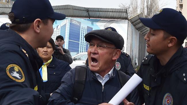 Police officers detain a participant in an anti-war rally in Gorky Park. Police in Kyrgyzstan detained around 20 activists who defied court bans on rallies opposing Russia's invasion of Ukraine. Picture: AFP