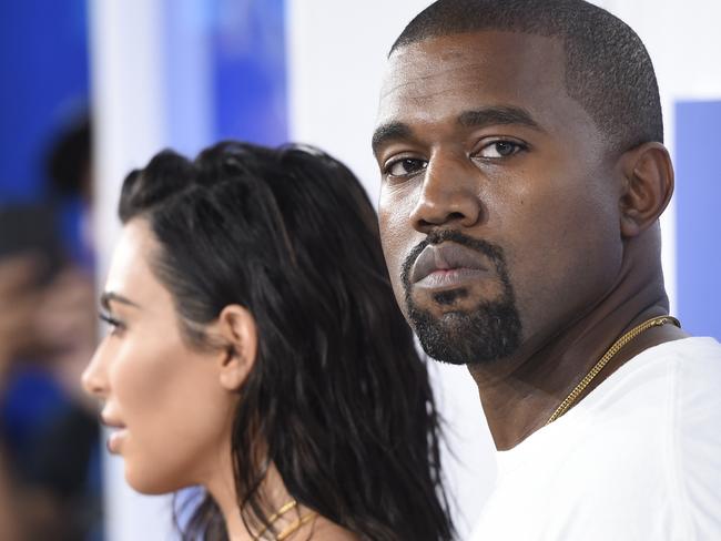 FILE - In this Aug. 28, 2016 file photo, Kim Kardashian West, left, and Kanye West arrive at the MTV Video Music Awards in New York. Kanye West will visit the White House on Thursday to meet with President Donald Trump and his son-in-law Jared Kushner talk about manufacturing in America, gang violence, prison reform and Chicago violence. (Photo by Evan Agostini/Invision/AP, File)