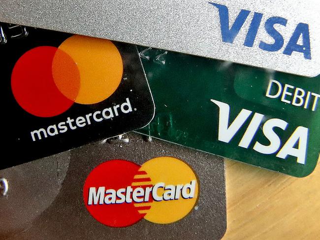 FILE - In this Feb. 20, 2019, file logos for credit cards are visible on the cards in Zelienople, Pa. On Friday, June 7, the Federal Reserve releases its April report on consumer borrowing. (AP Photo/Keith Srakocic, File)