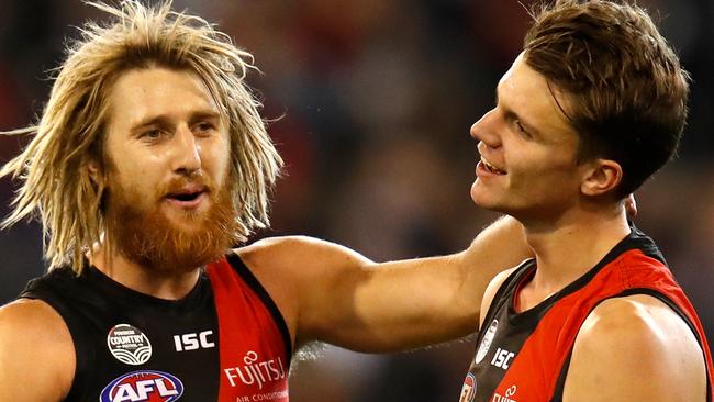 MELBOURNE, AUSTRALIA - MAY 19: Dyson Heppell (left) and Jordan Ridley of the Bombers celebrate during the 2018 AFL round nine match between the Essendon Bombers and the Geelong Cats at the Melbourne Cricket Ground on May 19, 2018 in Melbourne, Australia. (Photo by Michael Willson/AFL Media/Getty Images)