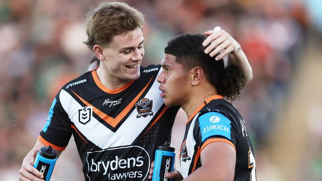 SYDNEY, AUSTRALIA - JUNE 23: Luke Laulilii of the Tigers (R) celebrates with Lachlan Galvin of the Tigers (L) after scoring a try during the round 16 NRL match between Wests Tigers and Canberra Raiders at Campbelltown Stadium, on June 23, 2024, in Sydney, Australia. (Photo by Matt King/Getty Images)