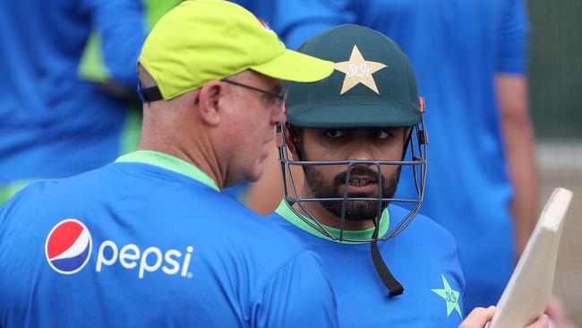 Pakistan's Captain Babar Azam worked closely with Matthew Hayden (L) to turn his form around. (Photo by SURJEET YADAV / AFP)