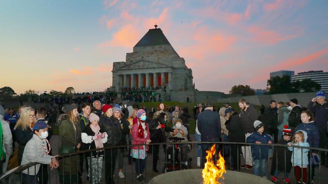 A colourful dawn sky behind the Shrine. Picture: David Crosling