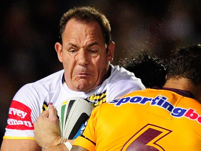 TOWNSVILLE, AUSTRALIA - MAY 09: Matthew Scott of the Cowboys is tackled by Josh Hoffman of the Broncos during the round nine NRL match between the North Queensland Cowboys and the Brisbane Broncos at 1300SMILES Stadium on May 9, 2014 in Townsville, Australia. (Photo by Ian Hitchcock/Getty Images)