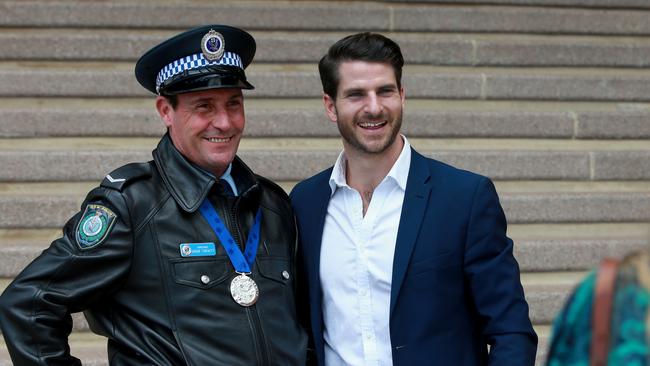 Police officer Arun Trevitt received an award for helping prevent Dan Price from jumping off the Sydney Harbour Bridge. Picture: Toby Zerna