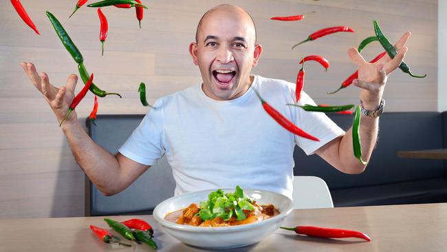 Tonka chef Adam D'Sylva with a bowl of his butter chicken and chillies. Picture: Nicki Connolly