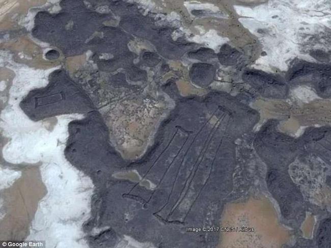 The mysterious stone structures are seen piled on ancient lava fields. Picture: Google Earth