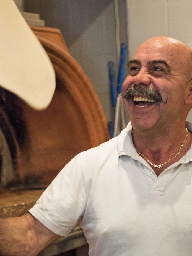 Co-owner Stefano Scopelliti tossing the pizza dough.