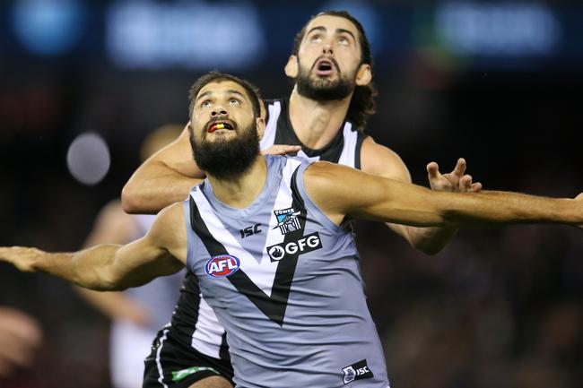 Power superstar Paddy Ryder tries to hold out Collingwood’s Brodie Grundy during the ruck battle at Marvel Stadium. . Picture: Michael Klein.