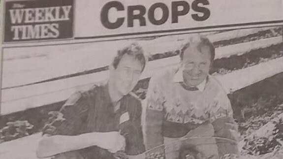 Peter Tracey, left, in the weekly times on his strawberry farm.