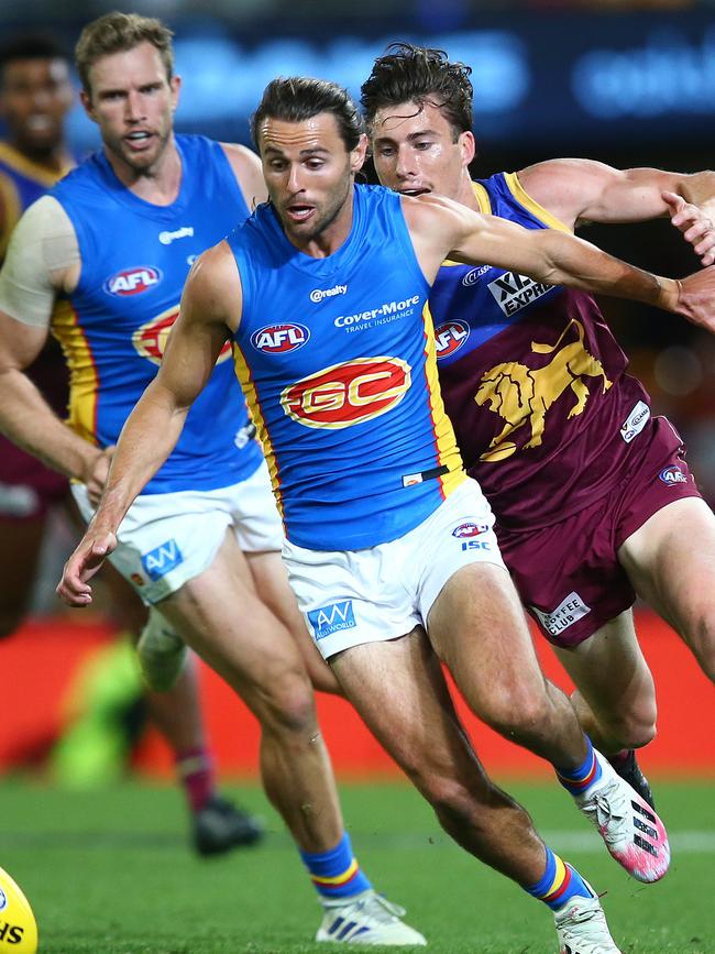 Lachie Weller of the Suns chases the ball during the round 16 AFL match between the Brisbane Lions and the Gold Coast Suns at The Gabba on September 09, 2020. (Photo by Jono Searle/AFL Photos/via Getty Images)