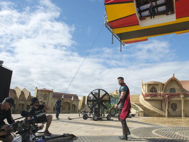 Hemsworth at work on one of Hennah’s creations, the outdoor Asgard set. Looking down on him from above is Tessa Thompson, who plays a new member of Team Thor, Valkyrie. Picture: Jasin Boland/Marvel/Disney