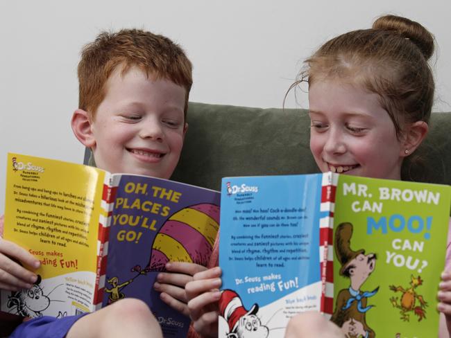 Declan Ryan, 6, with sister Emelie, 7, reading Dr Seuss books.