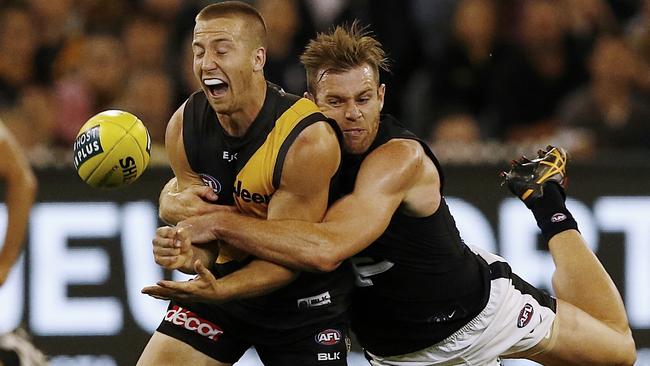 Kane Lambert is tackled by Sam Docherty. Picture: Wayne Ludbey