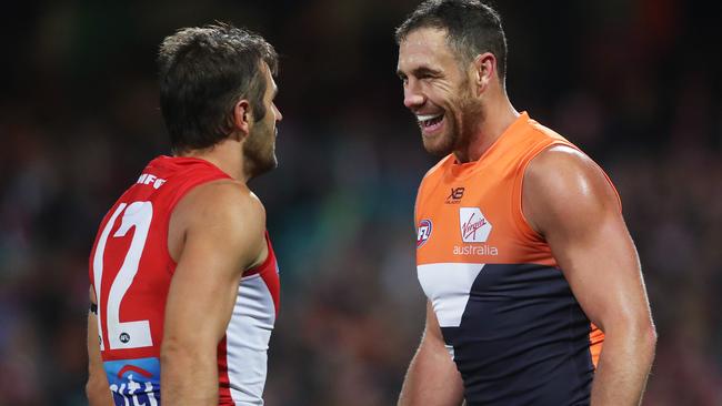 Giant Shane Mumford (right) flexed his muscle to Swan Josh Kennedy. Pic: Phil Hillyard
