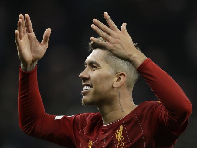 Liverpool's Roberto Firmino celebrates at the end of the English Premier League soccer match between Tottenham Hotspur and Liverpool at the Tottenham Hotspur Stadium in London, England, Saturday, Jan. 11, 2020. Liverpool won 1-0. (AP Photo/Matt Dunham)
