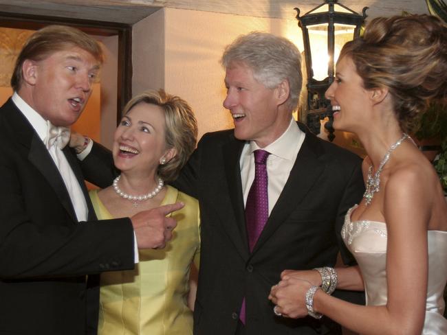 The Trumps share a picture perfect moment with the Clintons at their wedding reception. Picture: Maring Photography/Getty Images/Contour by Getty Images