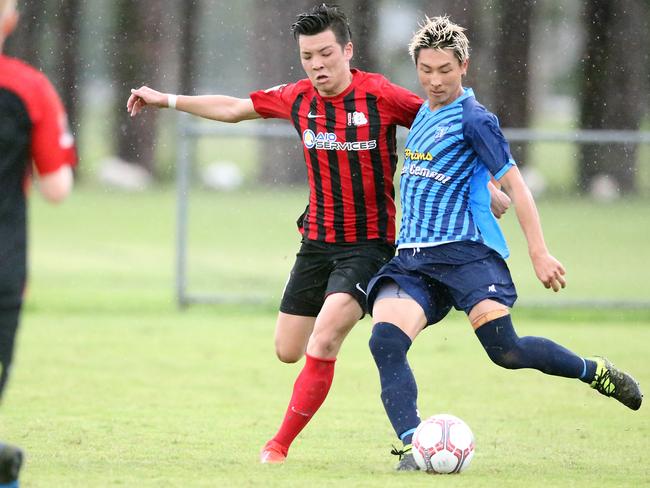 Burleigh Heads’ Ryuto Kondo battles Tweed United’s Toshiki Hatada at Pizzey Park on Saturday. Picture: Richard Gosling