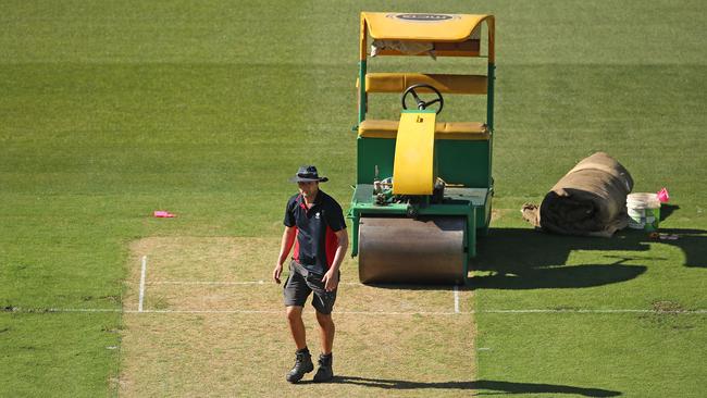 MCG groundsman and curator Matt Page inspects the pitch. Picture: Getty Images