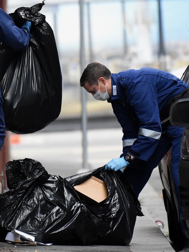 Police search through rubbish in Anthony St. Picture: Nicole Garmston