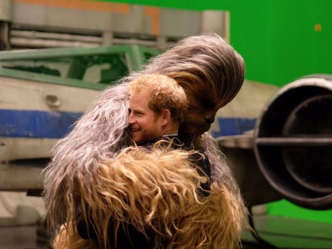 Prince Harry visits Star Wars and gives Chewie a hug. Picture: Kensington Royal/Twitter