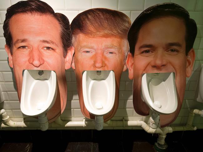 Cardboard cut-outs of 2016 US Presidential hopefuls (from left) Ted Cruz, Donald Trump and Marco Rubio on urinals in a pub in London as part of an informal poll for customers to log which they dislike the most.