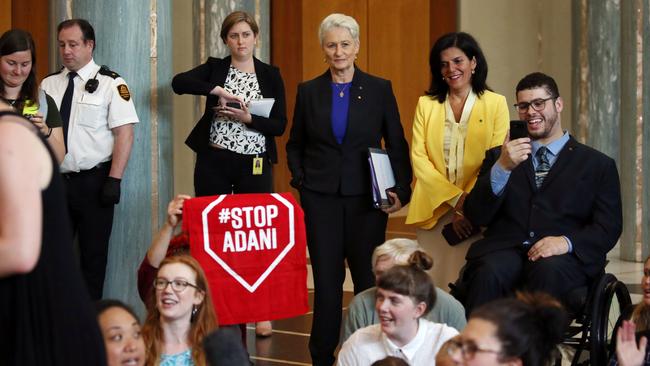 Kerryn Phelps, centre, Julia Banks and Jordon Steele-John with the young protesters inside Parliament House yesterday. Picture: Gary Ramage