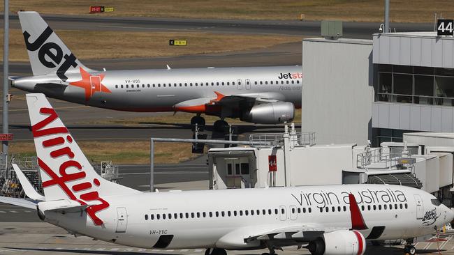 Qantas is racing to stop a former Jetstar executive jumping ship to rival Virgin.