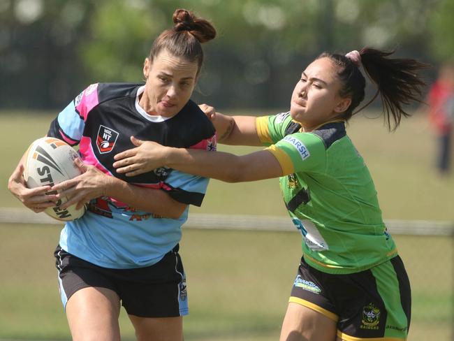 Tasha Medbury, left, and Shayla Barba in the NRL NT women's round 5 match between the Northern Sharks and the Palmerston Raiders. Picture: Glenn Campbell