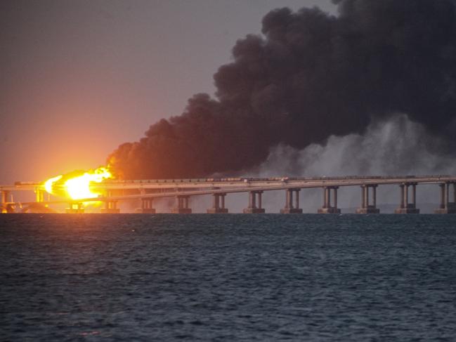 Flames and smoke rise from a bridge connecting Crimea and Russia in Kerch, on the Crimean Peninsula, in October 2022. Picture: AP