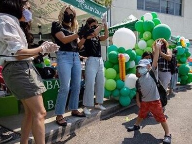 Meghan Markle cheers on a youngster during the charity event in Los Angeles. Picture: Instagram