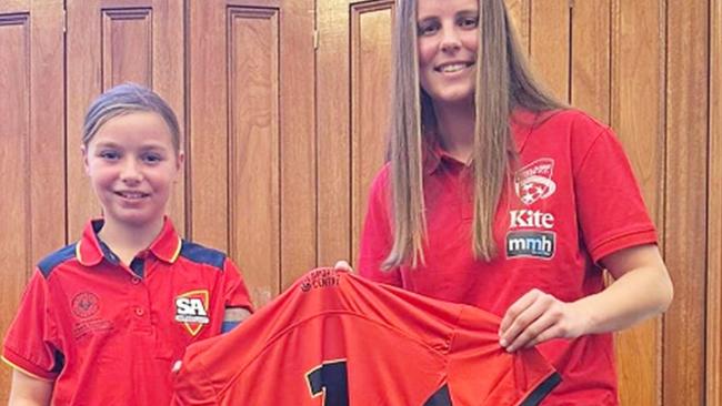 Matilda White (left) receiving her state uniform for the national titles. Picture: Supplied