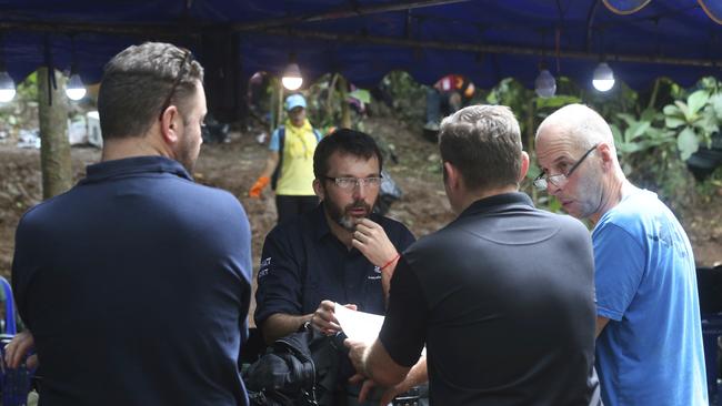 Australian Federal Police and Defence Force personnel talk about extraction plans.