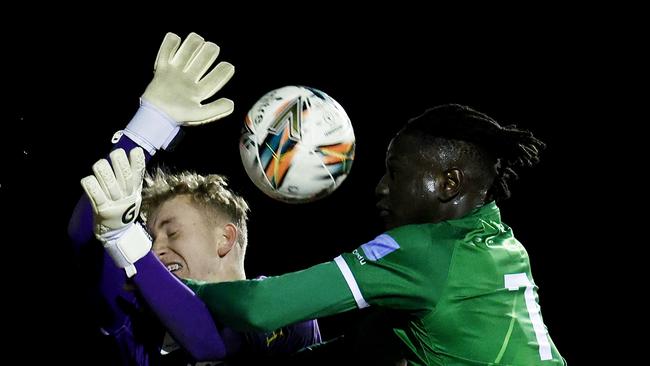 Magic goalkeeper Zac Bowling contesting the ball with Green striker Ajak Riak. Picture: Photo by Jonathan DiMaggio/Getty Images