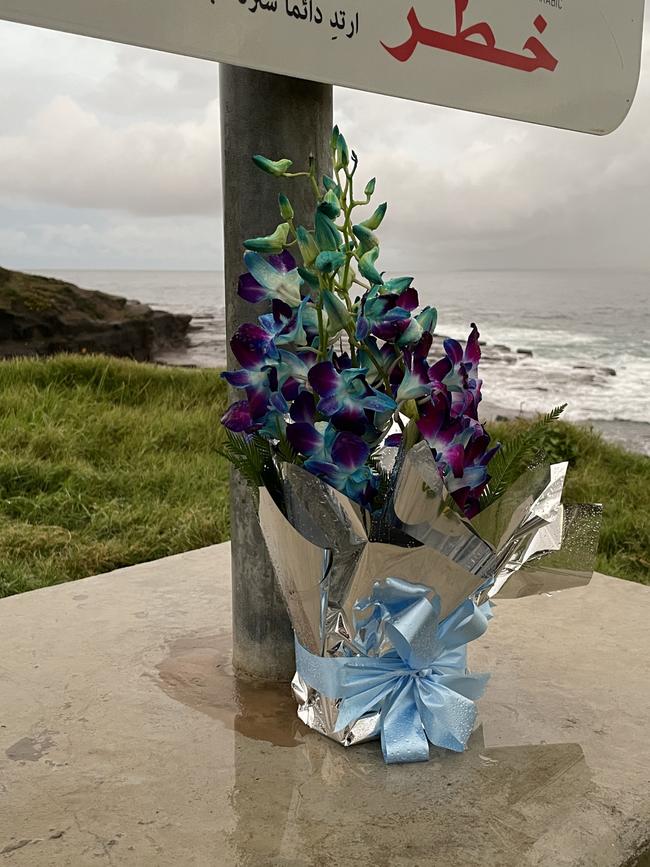 A floral tribute at the base of Port Kembla’s Hill 60 after the body of teenage rock fisherman Brendan Buxton-Hurd was found on, May 27, 2022. Picture: Dylan Arvela