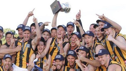 Jake McGrice (back with trophy) celebrates one of Mundulla's A Grade premierships. Picture: Mundulla Football Club