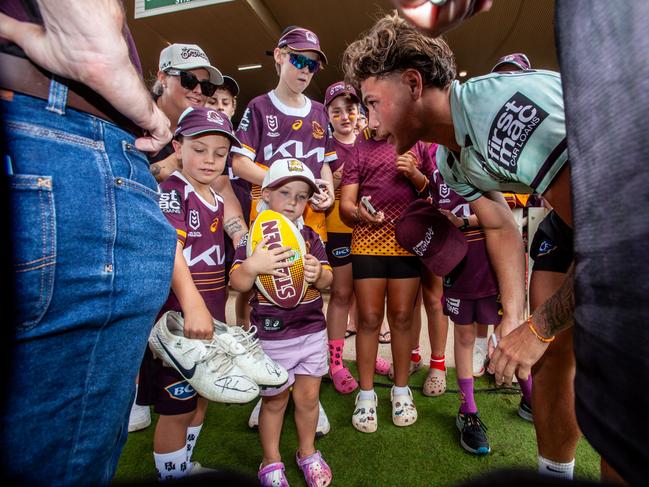 Reece Walsh gives his signed boots to a young fan. Picture: David Martinelli