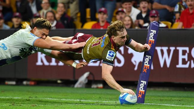 Tim Ryan of the Reds scores a try. Photo by Albert Perez/Getty Images