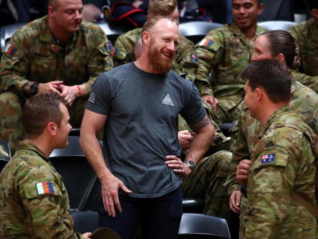 Australian Victoria Cross recipient Mark Donaldson talks to soldiers during the men's lightweight IP4 powerlifting during day five of the Invictus Games Sydney on October 24. Picture: Getty Images