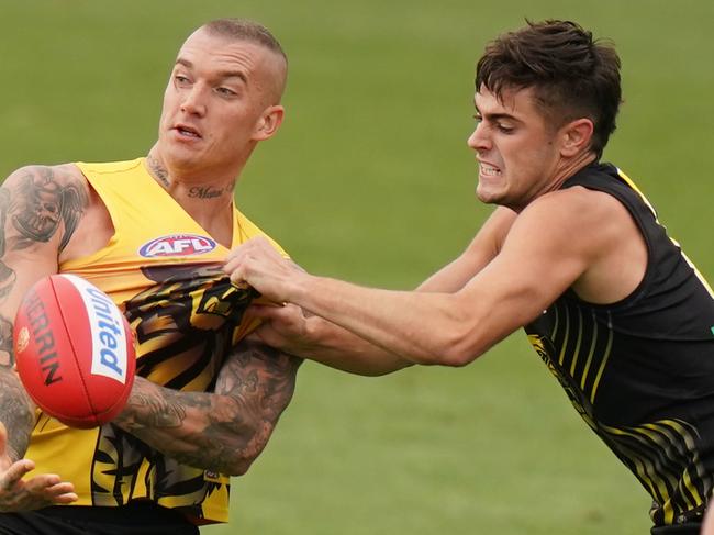 Dustin Martin of the Tigers is tackled by Patrick Naish of the Tigers during a Richmond Tigers AFL intraclub match at Punt Road Oval in Melbourne, Thursday, February 20, 2020. (AAP Image/Scott Barbour) NO ARCHIVING