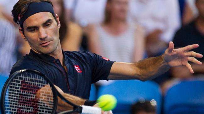 Roger Federer of Switzerland hits a return against Alexander Zverev of Germany during their Hopman Cup men's singles final. Picture: AFP  