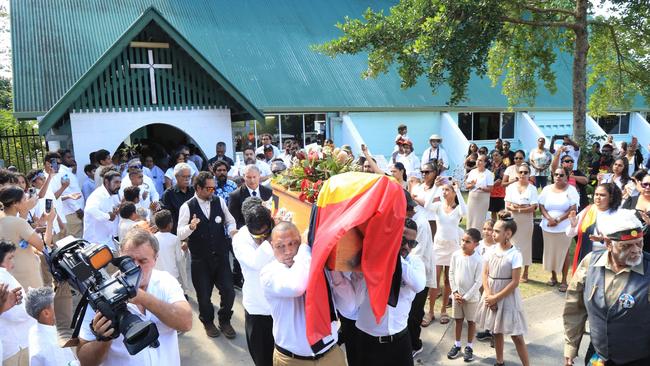 Pallbearers carry Alfred Neal's casket from St Alban's Anglican Church in Yarrabah on June 20, 2023. Picture: Peter Carruthers