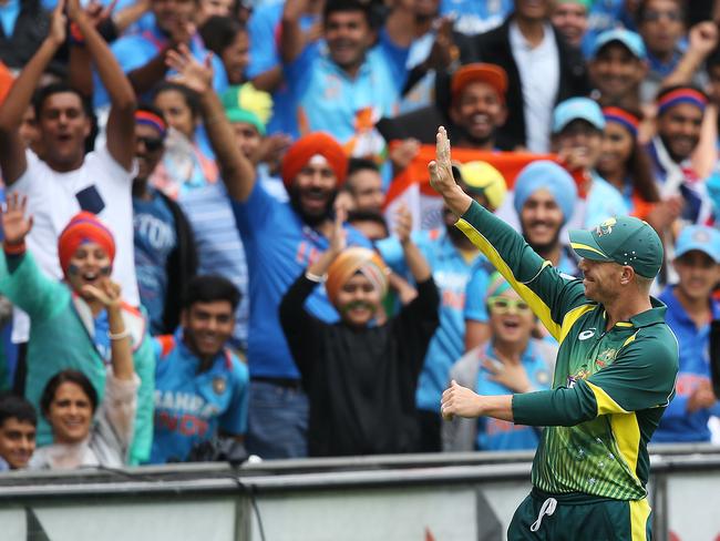 Warner waves to India fans at the SCG.