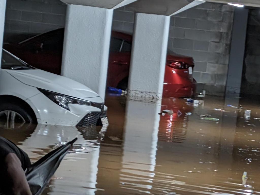 15 cars parked in the Chateau Bohemia underground car park were left ruined after the devastating flooding event in Edge Hill on Saturday. Picture: Supplied