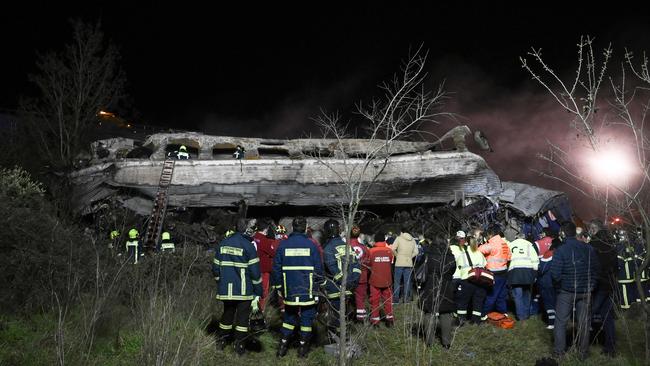 Rescue workers and emergency personnel search the wreckage for survivors. Picture: AFP.