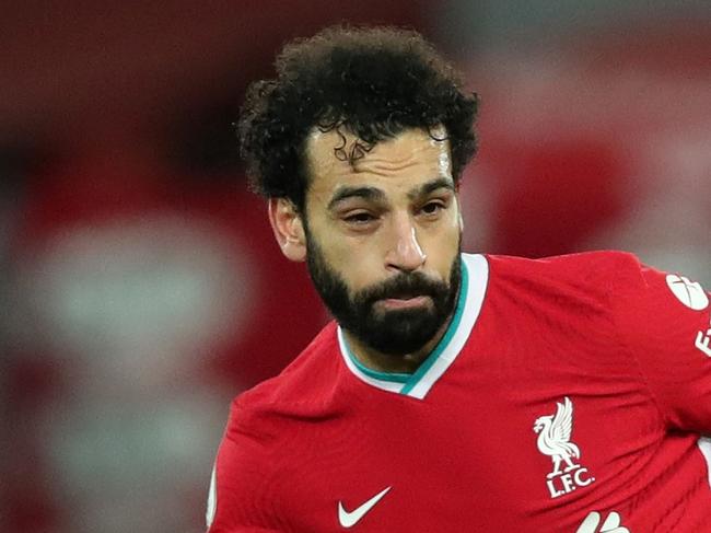 Liverpool's Egyptian midfielder Mohamed Salah runs with the ball during the English Premier League football match between Liverpool and Brighton and Hove Albion at Anfield in Liverpool, north west England on February 3, 2021. (Photo by Clive Brunskill / POOL / AFP) / RESTRICTED TO EDITORIAL USE. No use with unauthorized audio, video, data, fixture lists, club/league logos or 'live' services. Online in-match use limited to 120 images. An additional 40 images may be used in extra time. No video emulation. Social media in-match use limited to 120 images. An additional 40 images may be used in extra time. No use in betting publications, games or single club/league/player publications. /