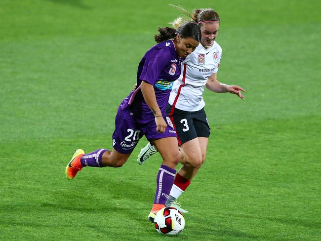 Samantha Kerr of Perth Glory breaks away from Nikola Orgill of the Wanderers during the round one W-League match between Perth and Western Sydney at nib Stadium on November 6, 2016 in Perth. Picture: Gary Day/Getty Images