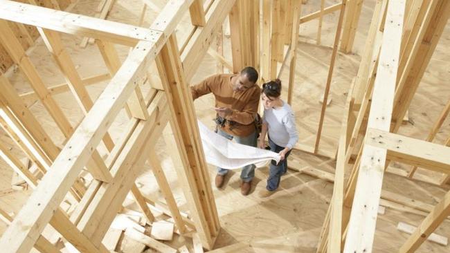 A couple discuss building plans.