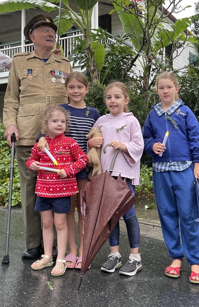 Alice and Charlotte Mitchell, Isla hooper and Isabelle Muir lit up their street on Monday morning in support of their veteran neighbour Trevor Robinson. Picture: Felicity Ripper